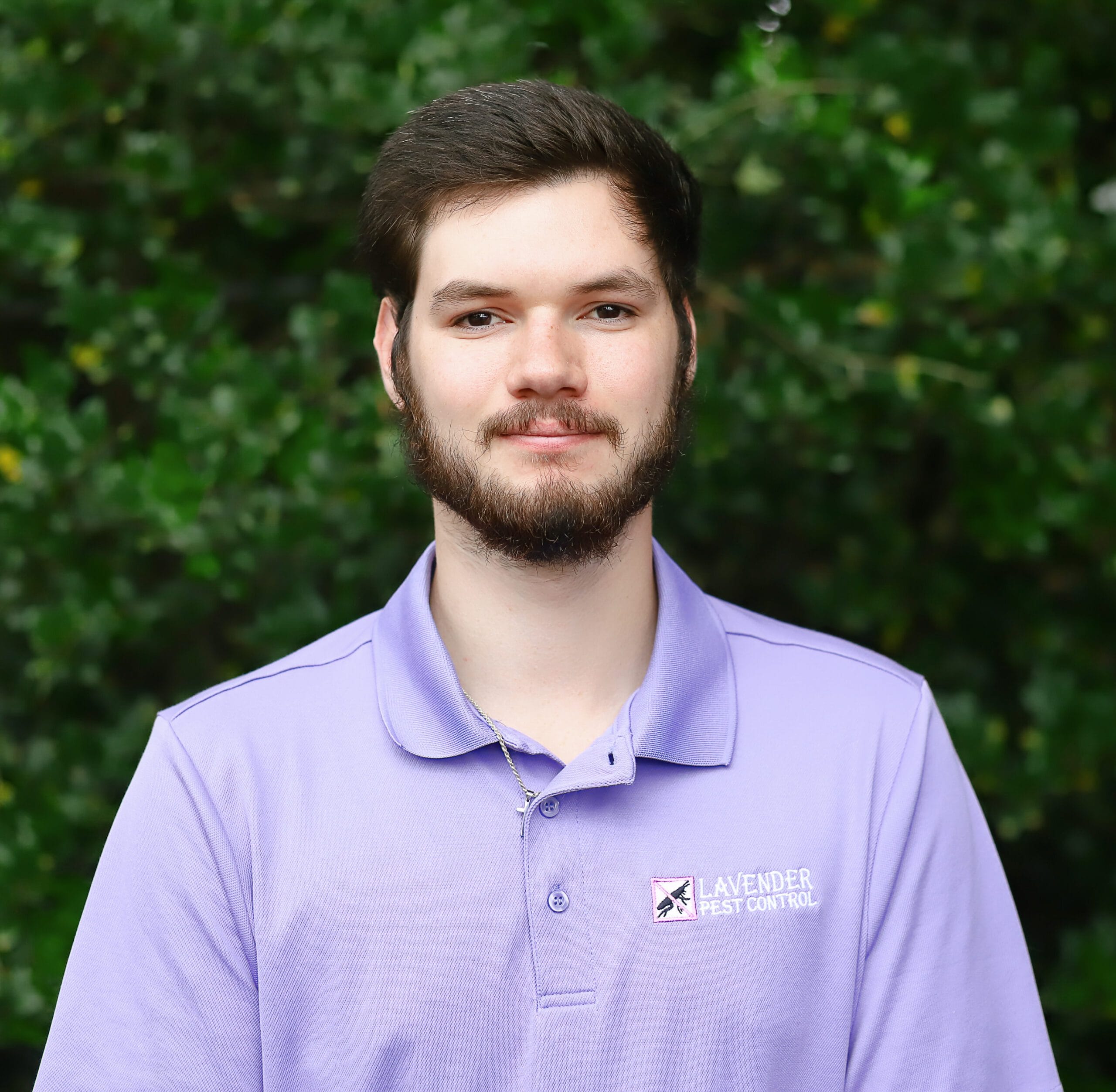 Young man in purple shirt outdoors